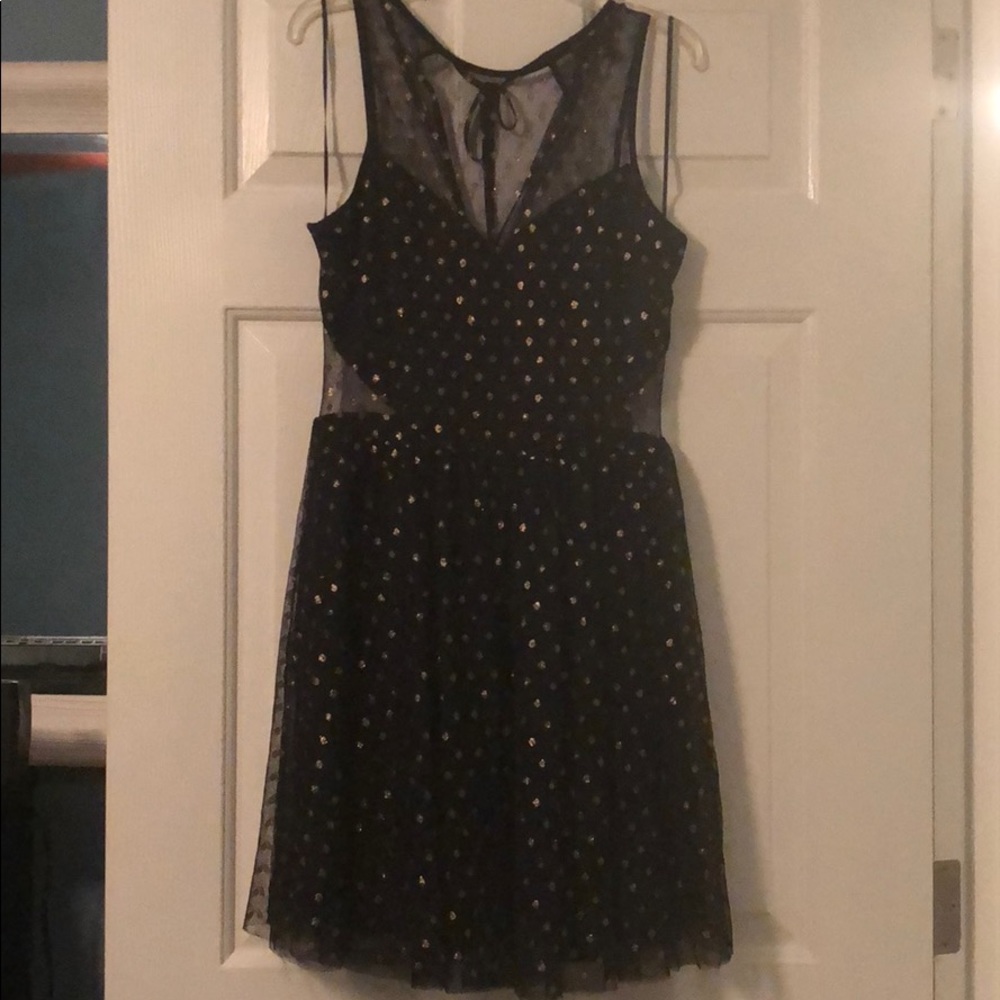 Black dress with gold polka dots and mesh detail
